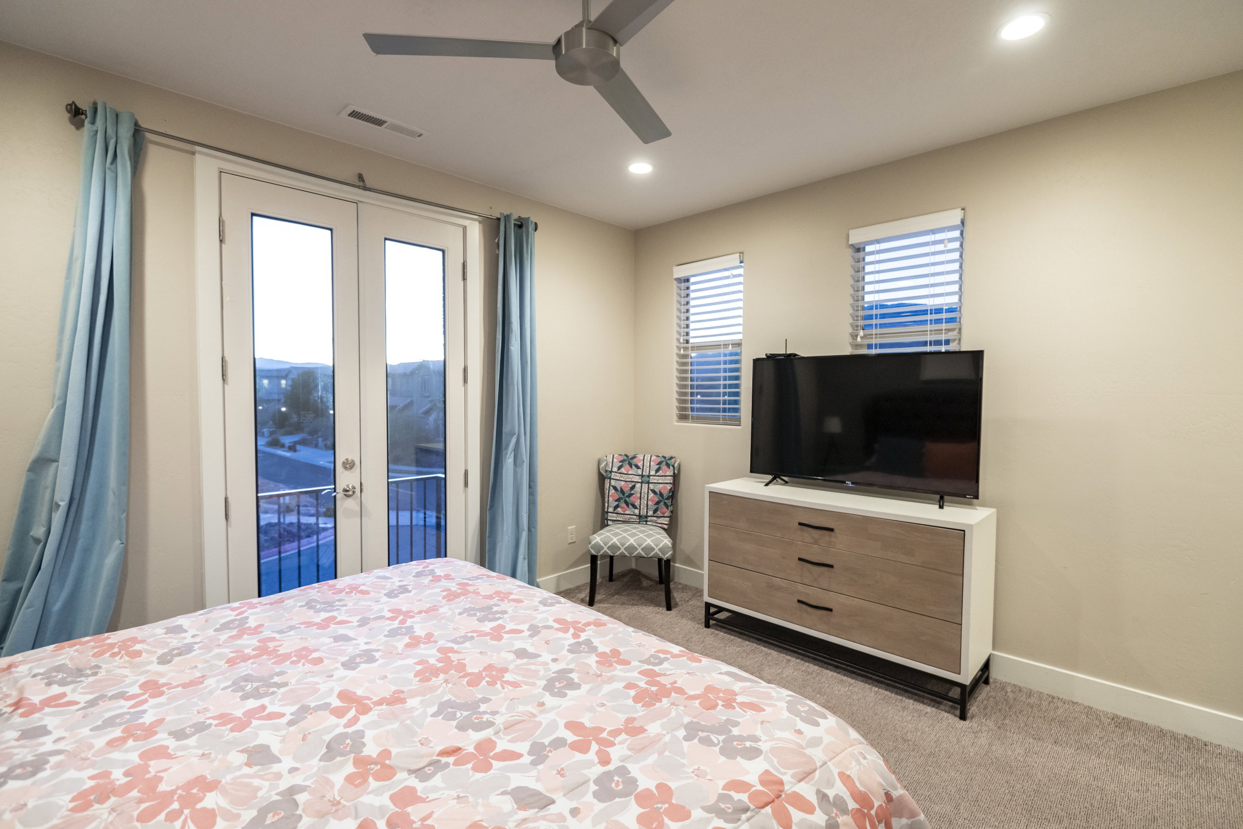 Bedroom featuring french doors, light colored carpet, access to outside, a ceiling fan, and recessed lighting