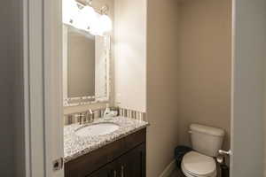 Bathroom featuring vanity and toilet