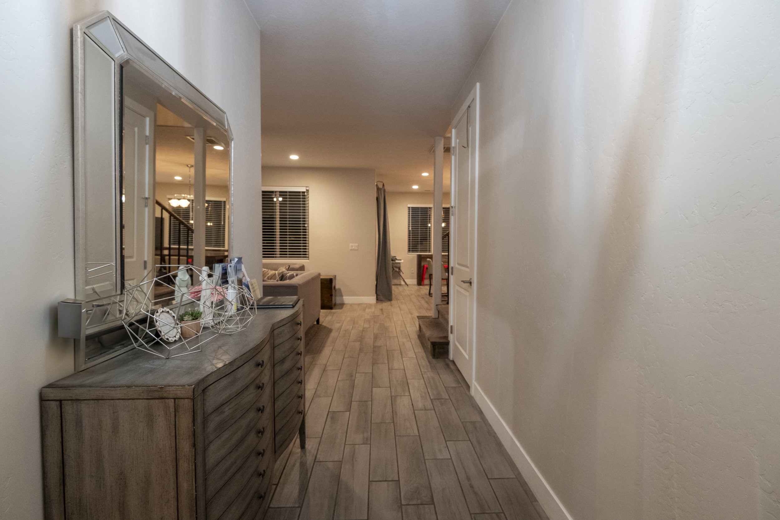 Corridor featuring wood finish floors and recessed lighting