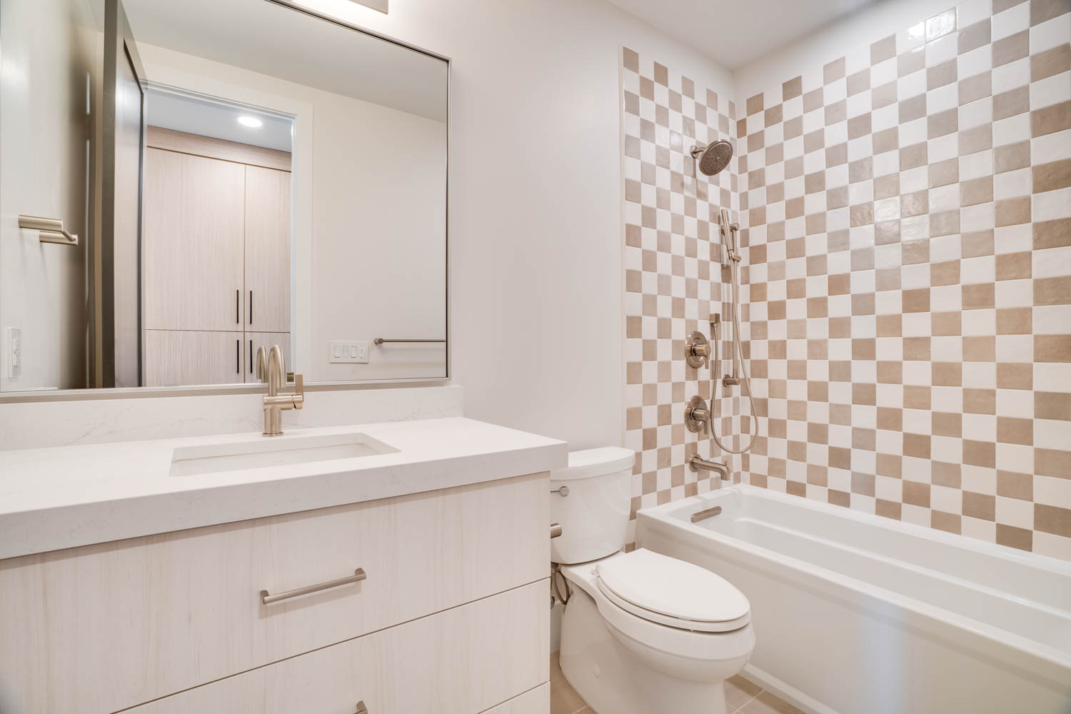 Full bath featuring vanity and  shower combination
