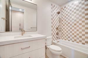 Full bath featuring vanity and  shower combination