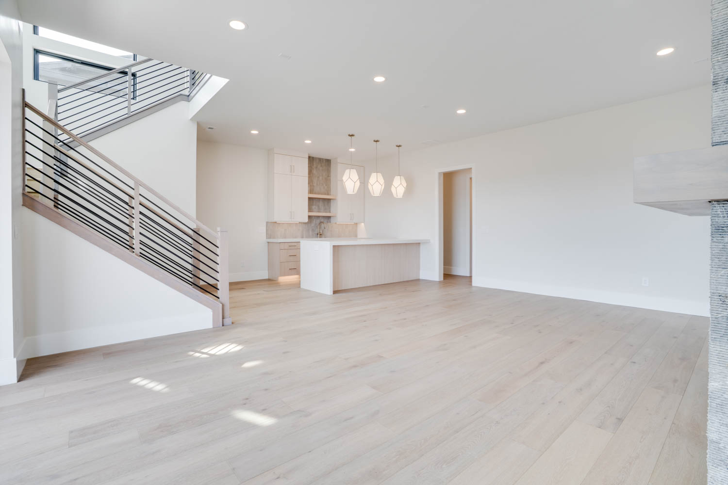 Unfurnished living room featuring recessed lighting and light wood-style floors