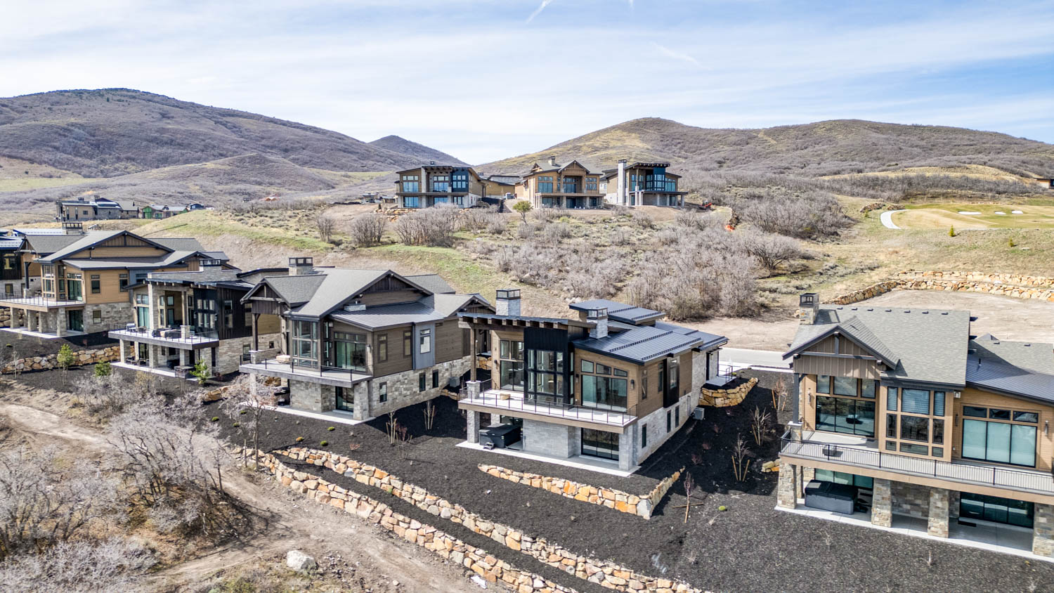 Aerial view of residential area with a mountainous background