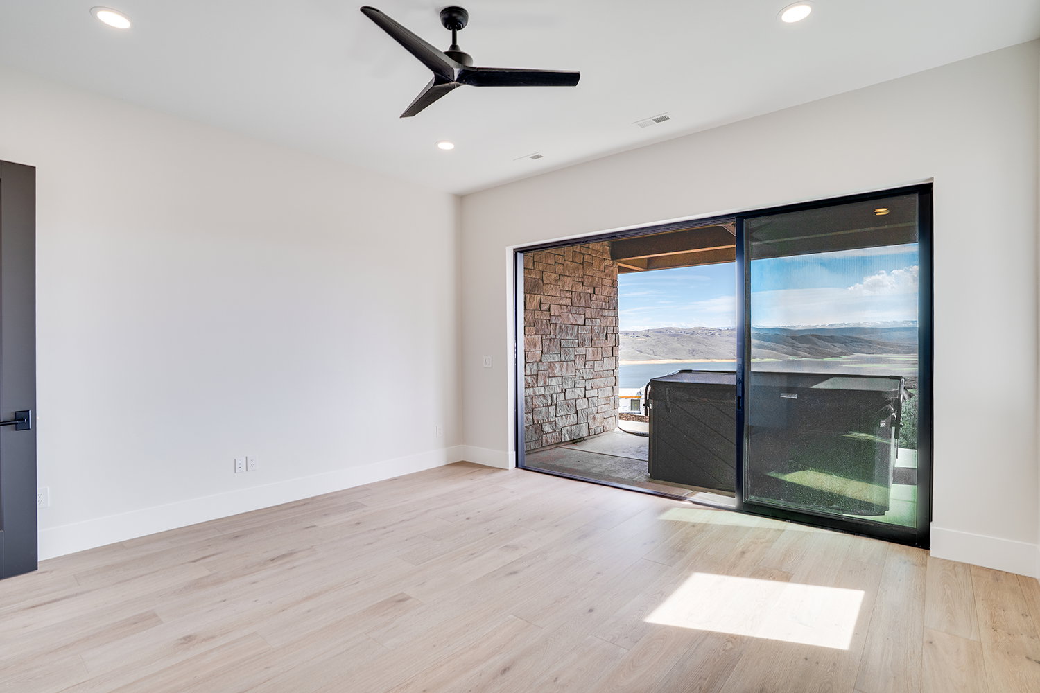Unfurnished room with a ceiling fan, light wood-style floors, and recessed lighting