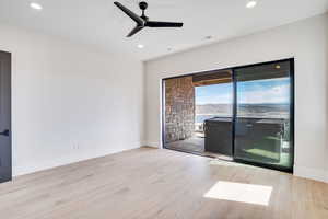 Unfurnished room with a ceiling fan, light wood-style floors, and recessed lighting