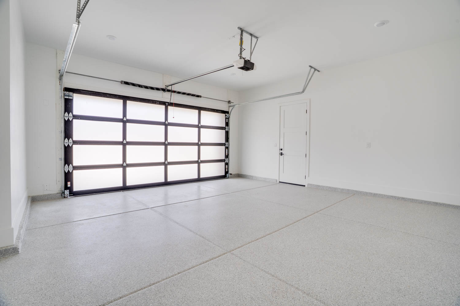 Garage featuring baseboards