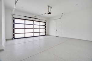 Garage featuring baseboards