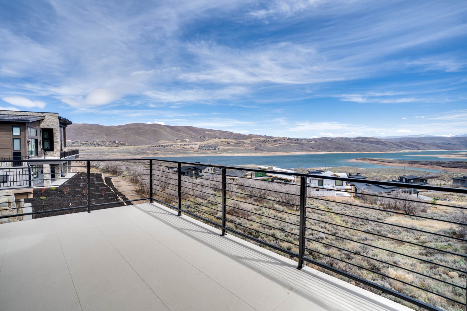 Balcony with a water and mountain view