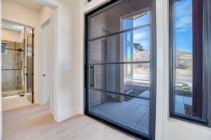 Doorway featuring wood finished floors