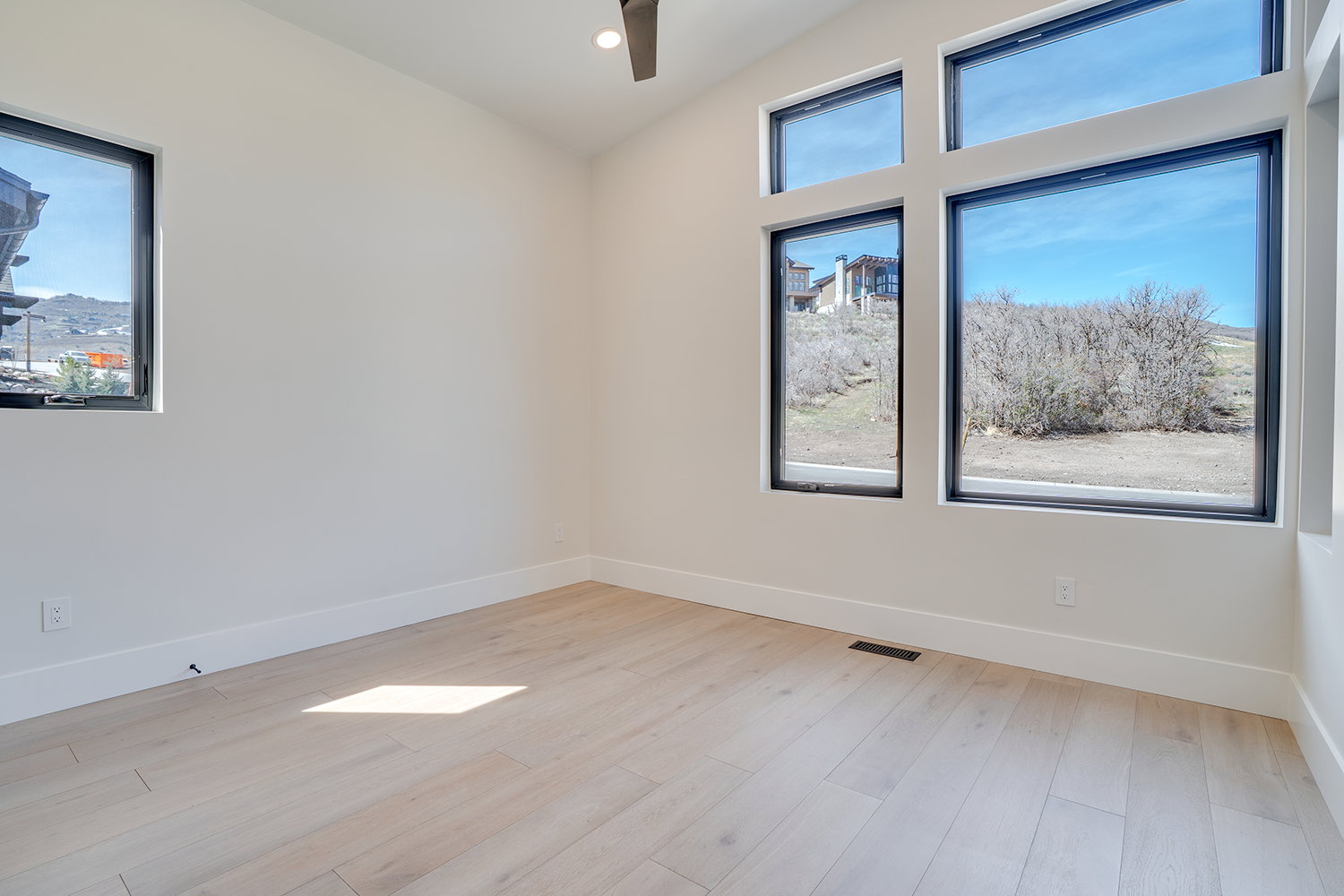 Empty room featuring light wood-style floors, recessed lighting, and ceiling fan