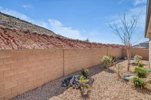 View of fenced backyard
