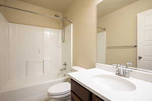 Bathroom featuring vanity and shower / bathtub combination