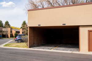Garage featuring covered parking