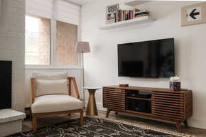 Living area with dark wood finished floors