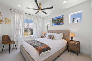 Bedroom featuring a ceiling fan, light colored carpet, and recessed lighting