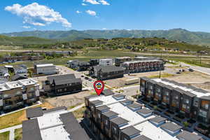 Aerial view of residential area with a mountain backdrop