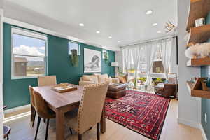 Dining room with recessed lighting and light wood-style floors