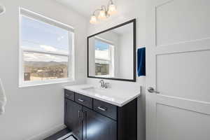 Bathroom featuring vanity and a mountain view
