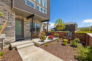 Doorway to property with stone siding
