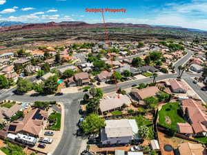 Aerial view of residential area featuring a mountain backdrop