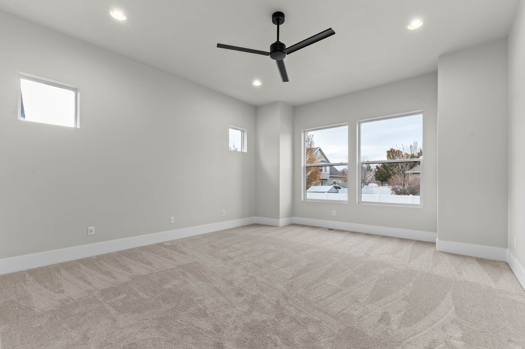 Unfurnished room featuring light carpet, recessed lighting, and a ceiling fan
