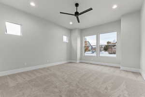 Unfurnished room featuring light carpet, recessed lighting, and a ceiling fan