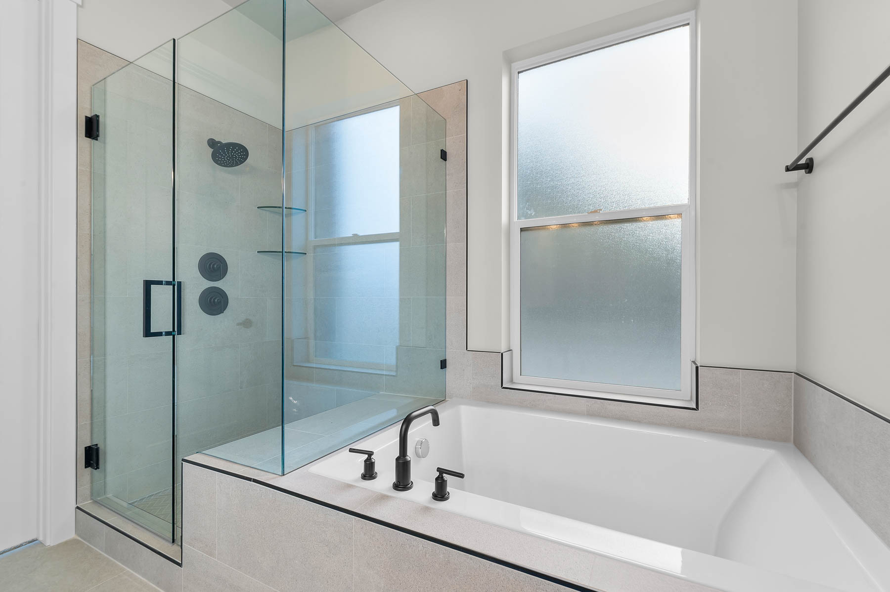 Full bath featuring a stall shower and a bath