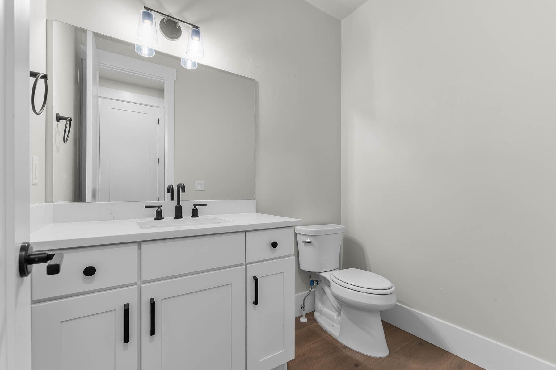 Bathroom with vanity and dark wood finished floors