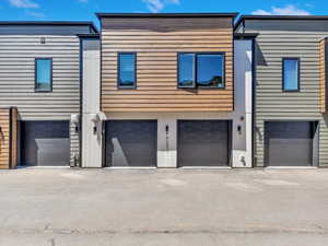 Back of house featuring a garage