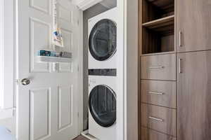Laundry area featuring stacked washer / dryer