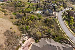 Aerial perspective of suburban area featuring a pool