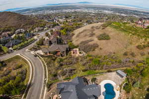 Aerial perspective of suburban area featuring a mountainous background