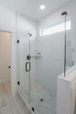 Full bathroom with a shower stall