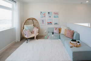 Carpeted bedroom featuring multiple windows