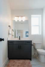 Bathroom with toilet and vanity