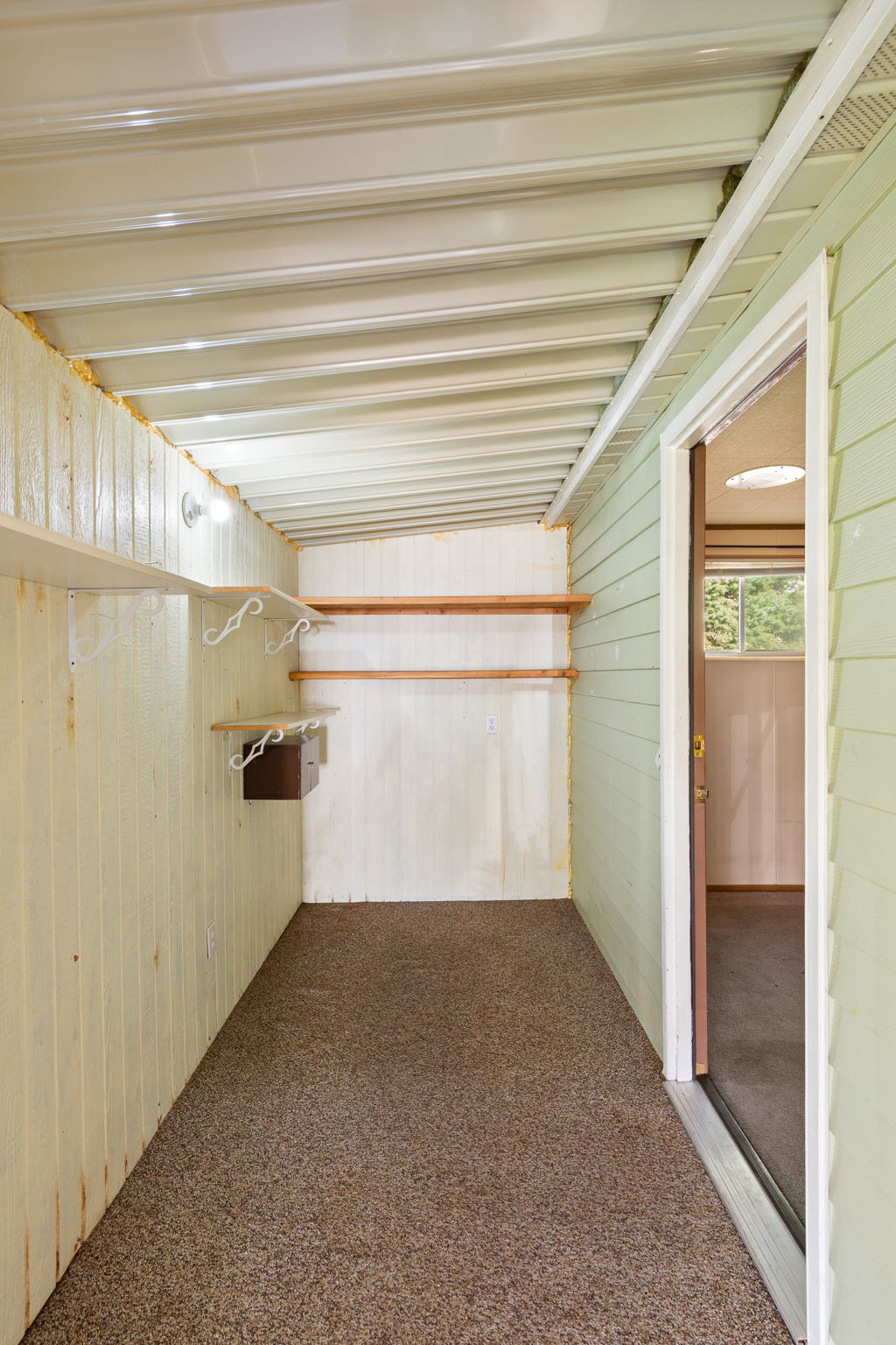 Walk in closet featuring carpet floors