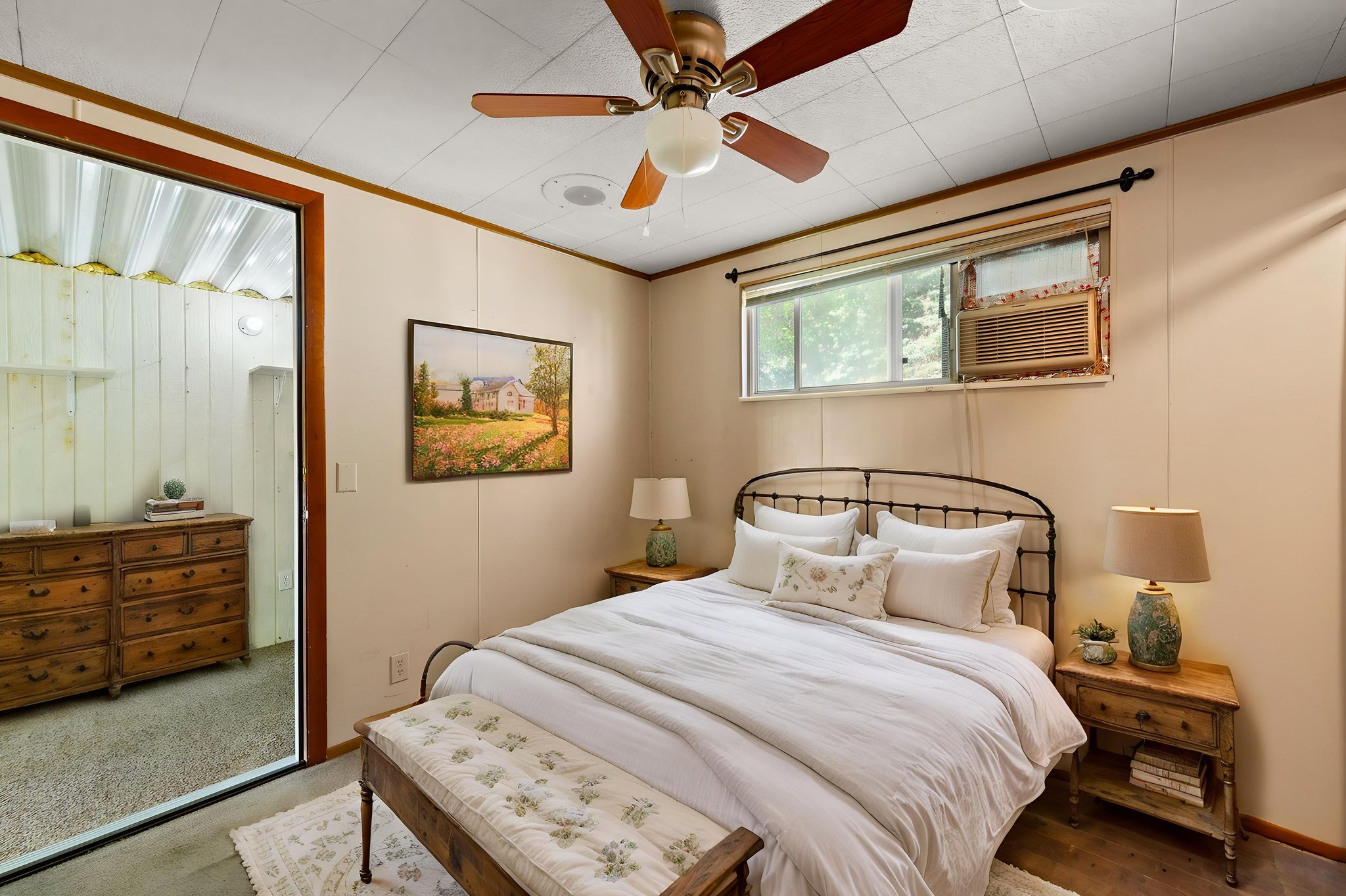 Bedroom with ornamental molding and ceiling fan