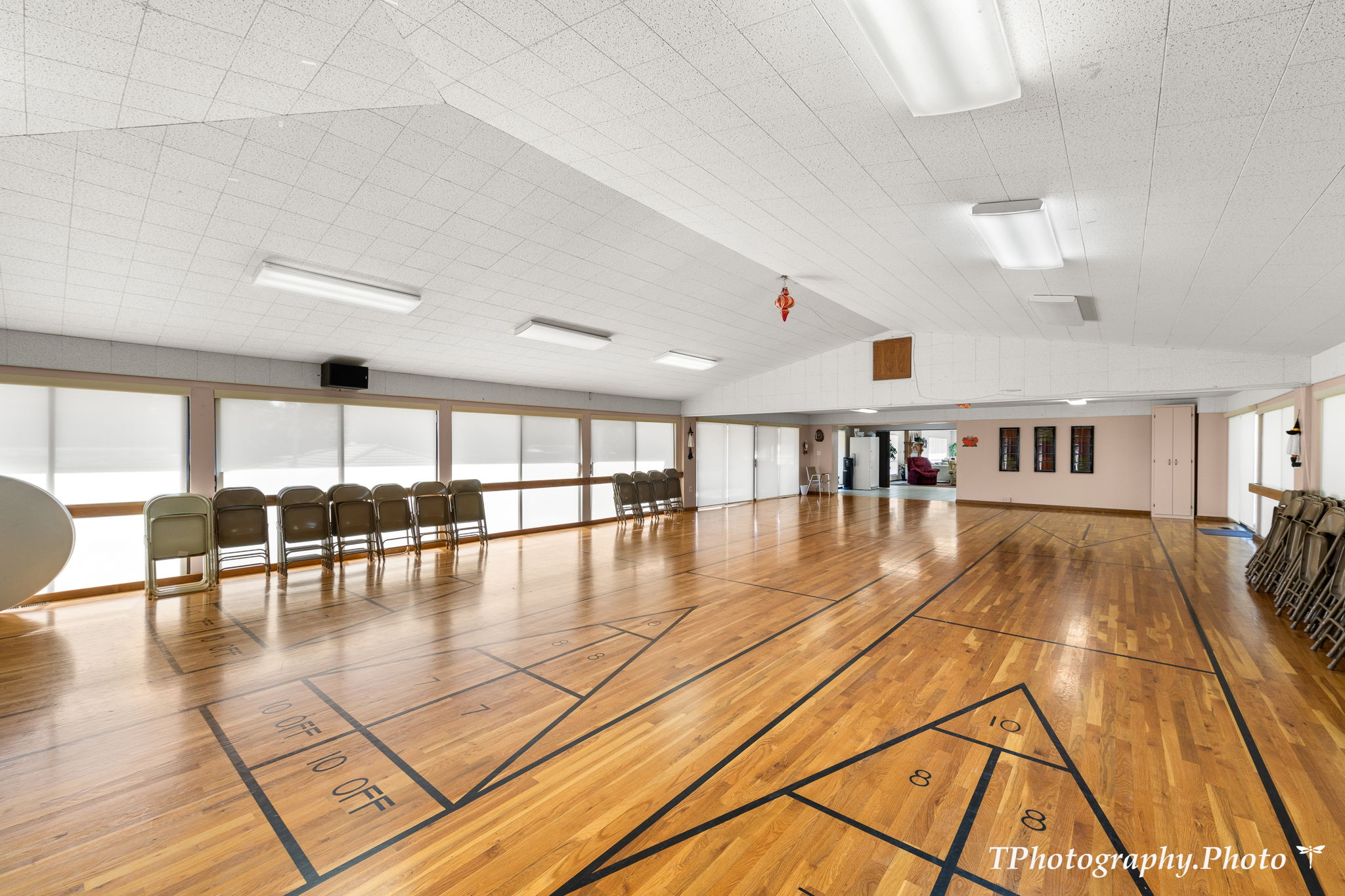 View of home's community featuring shuffleboard