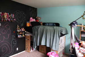 Bedroom with light carpet