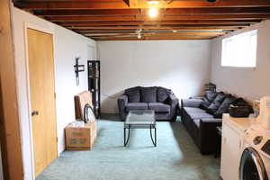 Living room featuring separate washer and dryer