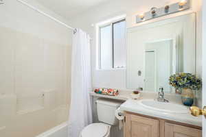 Bathroom featuring vanity and shower / tub combo