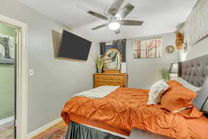 Bedroom with a ceiling fan and wood finished floors