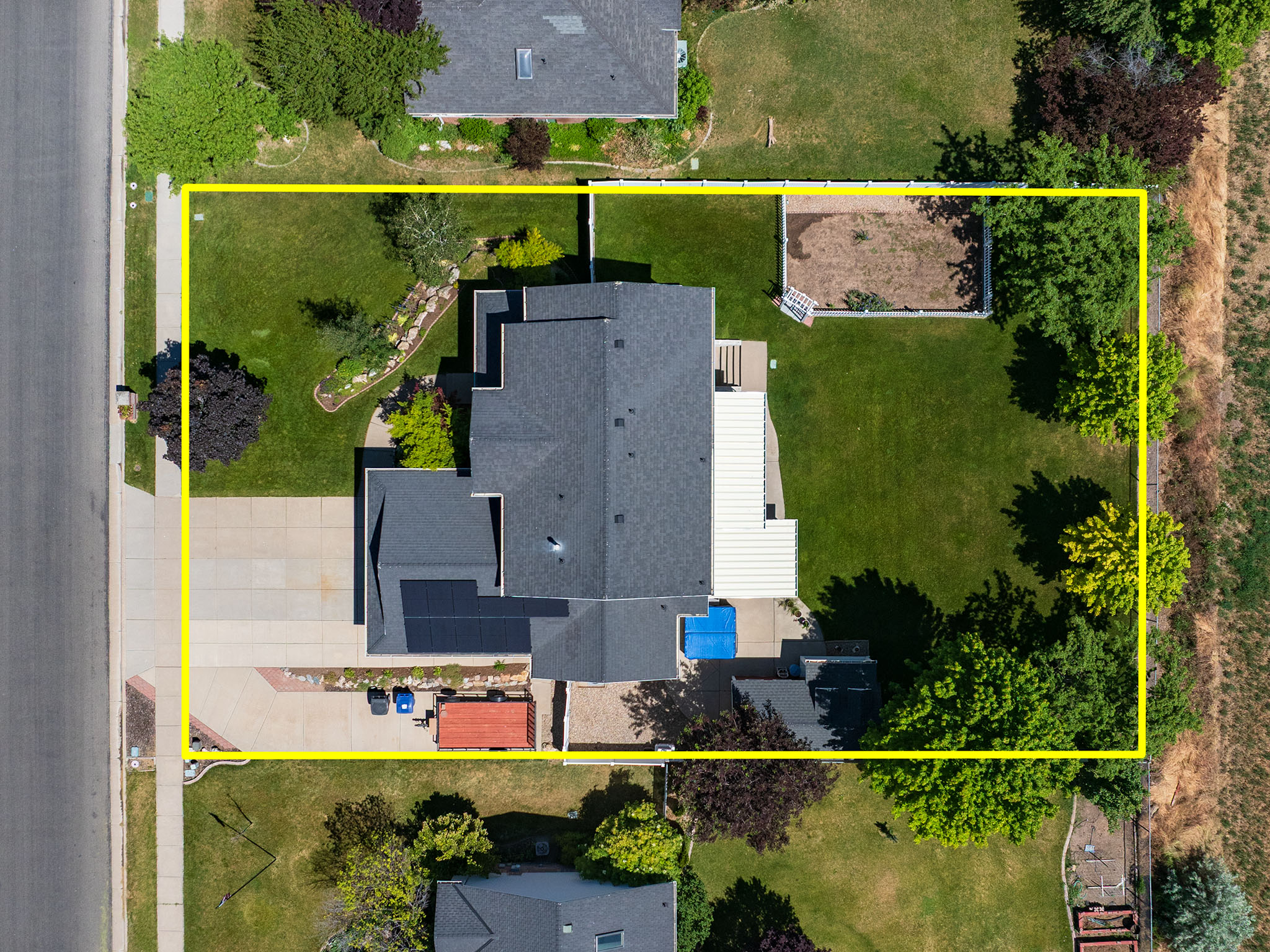 Aerial view showcasing a residential property with a large gabled roofline