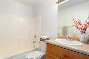 Full bath featuring vanity and  shower combination