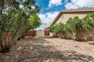 Fenced backyard with a gate