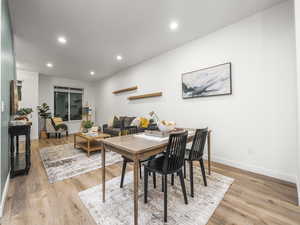 Dining space featuring recessed lighting and light wood-style flooring