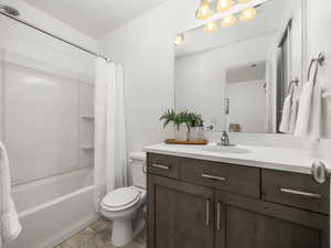 Full bathroom with vanity and shower / tub combo with curtain