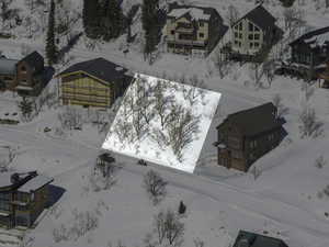 Snowy aerial view featuring a residential view
