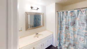Bathroom with vanity and a shower with curtain