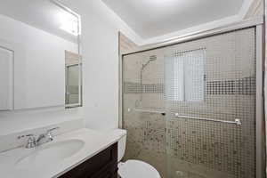 Bathroom with vanity and a stall shower